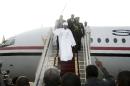 Sudanese President Omar al-Bashir arrives in Khartoum from Johannesburg on June 15, 2015