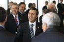 Mexico's President Enrique Pena Nieto laughs as he meets with members of the Economic Commission for Latin America and the Caribbean in Santiago, Chile, Friday, Jan. 25, 2012. Leaders from the European Union, Latin America and the Caribbean are gathering in Santiago for the CELAC-EU economic summit Jan 26-27. (AP Photo/Victor Ruiz Caballero)