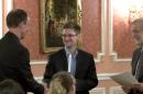 FILE - In this image made from video released by WikiLeaks on Oct. 11, 2013, former National Security Agency systems analyst Edward Snowden, center, receives the Sam Adams Award in Moscow, Russia. Europe bristles following Snowden's latest revelations about NSA tactics, including the alleged tapping of up to 35 world leaders' cell phones, which threaten to undermine America's ability to put its imprint on world affairs. At right is Raymond McGovern, a former U.S. government official, at left is former NSA executive Thomas Drake. (AP Photo, File)