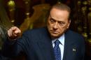 Former Prime Minister and leader of Forza Italia, Silvio Berlusconi arrives at the Senate in Rome on October 2, 2013