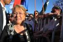 Former Chilean President and presidential candidate, Michelle Bachelet, greets supporters during the "Concert For Democracy" in Santiago, on October 5, 2013