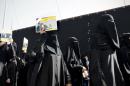 Saudi Shiite protestors take part in a demonstration against the death sentence on prominent Saudi Shiite cleric and anti-government protest leader Nimr al-Nimr