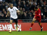 England's midfielder Andros Townsend runs with the ball during the World Cup 2014 qualifier between England and Montenegro at Wembley Stadium, London, on October 11, 2013