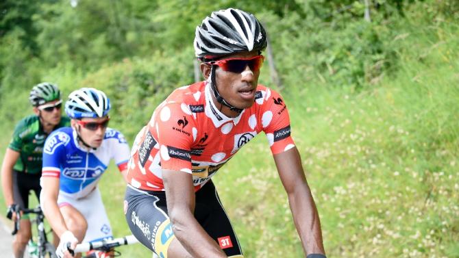 Eritrea&#39;s Daniel Teklehaimanot (R), wearing the best climber&#39;s polka dot jersey, seen riding during the Dauphine Criterium cycling race, between Le Bourget-du-Lac and Villars-les-Dombes, on June 8, 2015