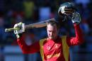 Zimbabwe's Brendan Taylor celebrates his 100 runs during the Pool B Cricket World Cup match with India at Eden Park in Aucklan, New Zealand, on March 14, 2015