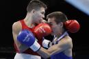 United States' Nico Miguel Hernandez, left, fights Russia's Vasilii Egorov during a men's light flyweight 49-kg preliminary boxing match at the 2016 Summer Olympics in Rio de Janeiro, Brazil, Monday, Aug. 8, 2016. (AP Photo/Frank Franklin II)