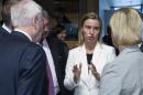 European Union High Representative Federica Mogherini, center, speaks with EU foreign ministers during a meeting at the EU Council building in Luxembourg on Monday, April 20, 2015. An Italian coast guard ship headed toward Sicily Monday to look for survivors of a capsized ship in what could be the Mediterranean's deadliest migrant tragedy, as EU foreign ministers gathered for an emergency meeting to discuss the crisis. Front left is Spanish Foreign Minister Jose Manuel Garcia-Margallo and front right is Swedish Foreign Minister Margot Wallstrom. (AP Photo/Thierry Monasse)