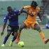 Ivory Coast's Kouassi fights for the ball with Tanzania's Nditi during their World Cup qualifier soccer match in Abidjan