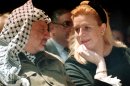 FILE - In this April 5, 1995 file photo, Suha Arafat and late Palestinian leader Yasser Arafat attend a conference in Gaza Strip. A former Israeli official on Wednesday, Aug. 29, 2012 denied suspicions that Israel poisoned Palestinian leader Yasser Arafat as France prepared to begin an investigation into his possible murder following a Swiss lab's claim that it found traces of a deadly substance on his belongings. (AP Photo/Nabil Judah, File)