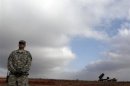 A U.S. soldier stands guard near a U.S. Patriot missile system at a Turkish military base in Gaziantep