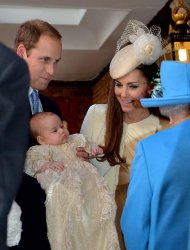 Queen Elizabeth II speaks with Britain's Prince William, and his wife Catherine as they arrive with their son Prince George of Cambridge for his Christening at Chapel Royal in St James's Palace in central London on October 23, 2013
