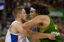 Brazil's Nene Hilario, right, fights for position with Serbia's Vladimir Stimac during the Group A Basketball World Cup match in Granada, Spain, Wednesday, Sept. 3, 2014. The 2014 Basketball World Cup competition will take place in various cities in Spain from Aug. 30 through to Sept. 14. (AP Photo/Daniel Tejedor)