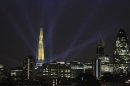 A laser beam touches the Gherkin from the Shard during the laser and searchlight show which marks the completion of the exterior of the Shard building in central London