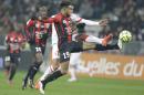 Nice's Jordan Amavi, front, challenges for the ball with Monaco's Matheus Thiago de Carvalho during their French League One soccer match, Friday, Feb. 20, 2015, in Nice stadium, southeastern France. (AP Photo/Lionel Cironneau)