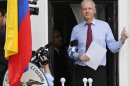 Wikileaks founder Julian Assange gestures as he appears to speak from the balcony of Ecuador's embassy in London