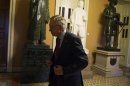 U.S. Senate Majority Leader Reid walks to his office at the U.S. Capitol after returning from a meeting with President Obama in Washington
