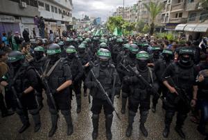 FILE - In this Dec. 14, 2014 file photo, masked Palestinian &hellip;