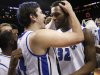 Saint Louis' Cody Ellis, left, celebrates with Cory Remekun after the NCAA college basketball game against the Virginia Commonwealth in the championships of the Atlantic 10 Conference tournament, Sunday  March 17, 2013, in New York. Saint Louis beat Virginia Commonwealth 62-56.  (AP Photo/Seth Wenig)