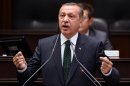 Turkish Prime Minister Recep Tayyip Erdogan addresses his supporters and lawmakers at the parliament in Ankara, Turkey, Tuesday, June 25, 2013.(AP Photo)