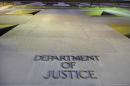 FILE - In this May 14, 2013, file photo, the Department of Justice headquarters building in Washington is photographed early in the morning. The Drug Enforcement Administration does a poor job overseeing the millions of dollars in payments it distributes to confidential sources, relies on tipsters who operate with minimal oversight or direction and has paid informants who are no longer meant to be used, according to a government watchdog report issued Thursday, Sept. 29, 2016. . (AP Photo/J. David Ake, File)