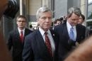 Former Virginia Gov. Bob McDonnell leaves the federal courthouse in Richmond, Va., with his lawyer John L. Brownlee on the second day of his and his wife Maureen's corruption trial, Tuesday, July 29, 2014. (AP Photo/Richmond Times-Dispatch, Alexa Welch Edlund)