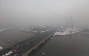 A residential block obscured by smog in Changchun, …