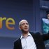 Amazon CEO Bezos holds up the new Kindle Fire tablet at news conference in New York