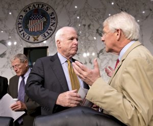 Sen. John McCain, R-Ariz., center, and Sen. Roger Wicker, …