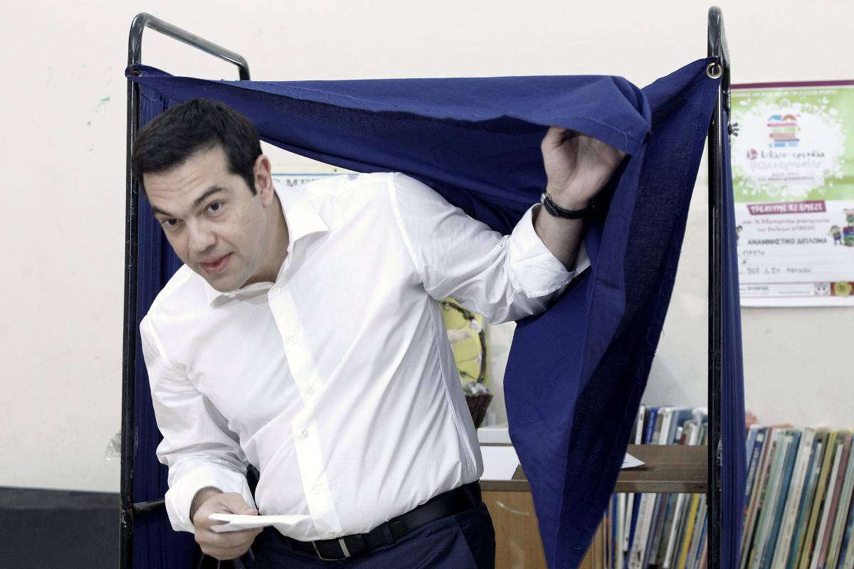Greek Prime Minister Alexis Tsipras exits a voting booth at a polling station in Athens