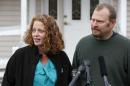 Nurse Kaci Hickox is accompanied by her boyfriend Ted Wilbur as she speaks to reporters outside their home, Friday, Oct. 31, 2014, in Fort Kent, Maine. A Maine judge gave Hickox the OK to go wherever she pleases, handing state officials a defeat Friday in their bid to restrict her movements as a precaution against Ebola. (AP Photo/Robert F. Bukaty)