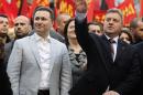 Presidential candidate of ruling VMRO-DPMNE Ivanov greets his supporters next to Macedonian PM Gruevski during an election rally in Veles