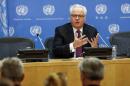 Russia's United Nations Ambassador Vitaly Churkin speaks during a news conference marking the start of his month-long term as president of the U.N. Security Council at the U.N. headquarters in New York
