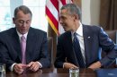 President Barack Obama talks with House Speaker John Boehner of Ohio, prior to speaking to media, in the Cabinet Room of the White House in Washington, Tuesday, Sept. 3, 2013, before a meeting with members of Congress to discuss the situation in Syria. (AP Photo/Carolyn Kaster)