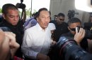 Malaysian opposition leader Anwar Ibrahim, center, is surrounded by media as he arrives at the High Court to face charges of participating in an illegal street protest in Kuala Lumpur, Malaysia, Tuesday, May 22, 2012. (AP Photo/Mark Baker)