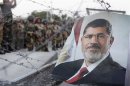 A portrait of former Egyptian President Mohamed Mursi is seen near a Republican Guard building in Cairo