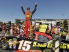 Clint Bowyer celebrates on top of his car after winning the NASCAR Sprint Cup Series auto race, Sunday, June 24, 2012, in Sonoma, Calif. (AP Photo/Eric Risberg)