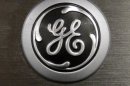 FILE - In this Monday, Sept. 10, 2012 file photo, a General Electric logo is seen on a kitchen stove at a Lowe's store in Framingham, Mass. General Electric Co. is reporting, Friday, Jan. 18, 2013, that net income rose 8 percent in the fourth quarter as earnings at all of the conglomerate's industrial segments improved due to growth in developing economies. (AP Photo/Steven Senne, File)