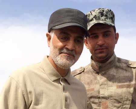 Iranian Revolutionary Guard Commander Soleimani stands at the frontline during offensive operations against Islamic State militants in the town of Tal...