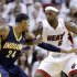 Miami Heat forward LeBron James (6) defends Indiana Pacers forward Paul George (24) during the second half of Game 5 in the NBA basketball playoffs Eastern Conference finals, Thursday, May 30, 2013, in Miami. (AP Photo/Lynne Sladky)