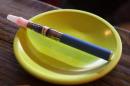 An e-cigarette sits in a tray on the bar at the Henley Vaporium in New York City