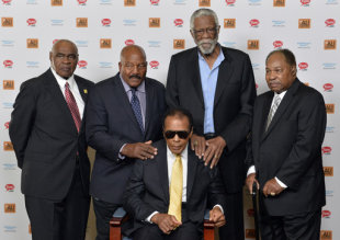 John Wooten, Jim Brown, Bill Russell, and Bobby Mitchell stand behind Muhammad Ali. They all reunited in 2014. (AP)