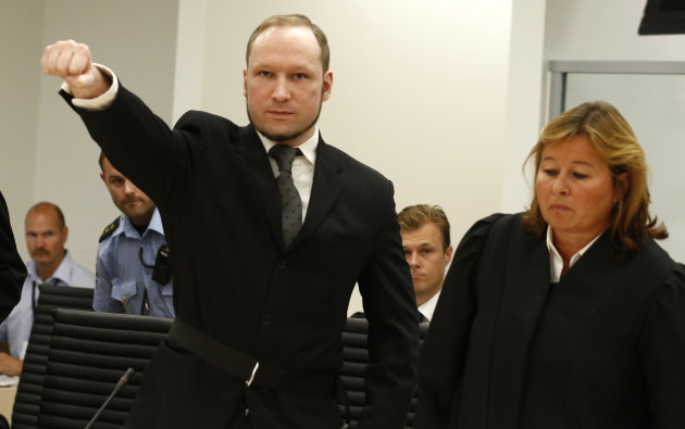 Mass murderer Anders Behring Breivik, makes a salute after arrives at the court room in a courthouse in Oslo Friday Aug. 24, 2012 . Breivik, who admitted killing 77 people in Norway last year, declared sane and sentenced to prison for bomb and gun attacks.(AP Photo/Heiko Junge / NTB scanpix, Pool)