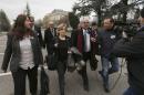 Members of Syrian opposition delegation speak to journalist as they arrive for first meeting face to face with Syrian government delegation and U.N.-Arab League envoy for Syria Brahimi at U.N. office in Geneva