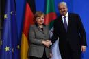 German Chancellor Angela Merkel and Algerian Prime Minister Abdelmalek Sellal shake hands after a news conference following talks in Berlin on January 12, 2016