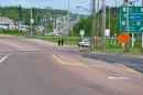 Royal Canadian Mounted Police block a highway onramp along Berry Mills road in Moncton, New Brunswick as the RCMP maintains a lockdown in the area on Thursday, June 5, 2014. A RCMP manhunt for a gunman suspected of killing three Mounties and wounding two others passed the 12-hour mark Thursday in Moncton as a large section of the New Brunswick city was under a virtual siege. (AP Photo/The Canadian Press, Marc Grandmaison)