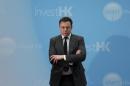 Tesla Chief Executive Elon Musk stands on the podium as he attends a forum on startups in Hong Kong