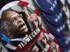 Campaign buttons for Republican Presidential candidate Herman Cain are seen on sale as he campaigned in Talladega, Ala., Friday, Oct. 28, 2011. (AP Photo/Dave Martin)