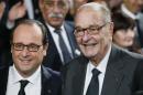 French President Francois Hollande and former French President Jacques Chirac pose before attending the award ceremony for the Prix de la Fondation Chirac at the Quai Branly Museum in Paris