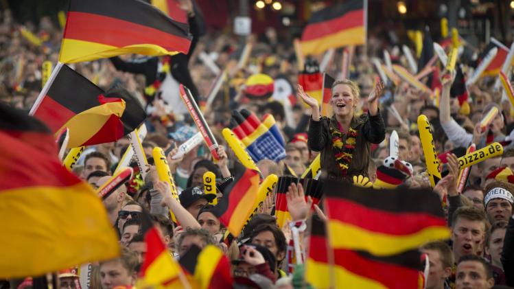 German soccer fans watch the 2014 World Cup Group G soccer match between Germany and Ghana at public viewing zone called &#39;fan mile&#39; in Berlin