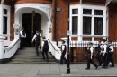 Police officers arrive outside Ecuador's embassy where Wikileaks founder Julian Assange is residing in London